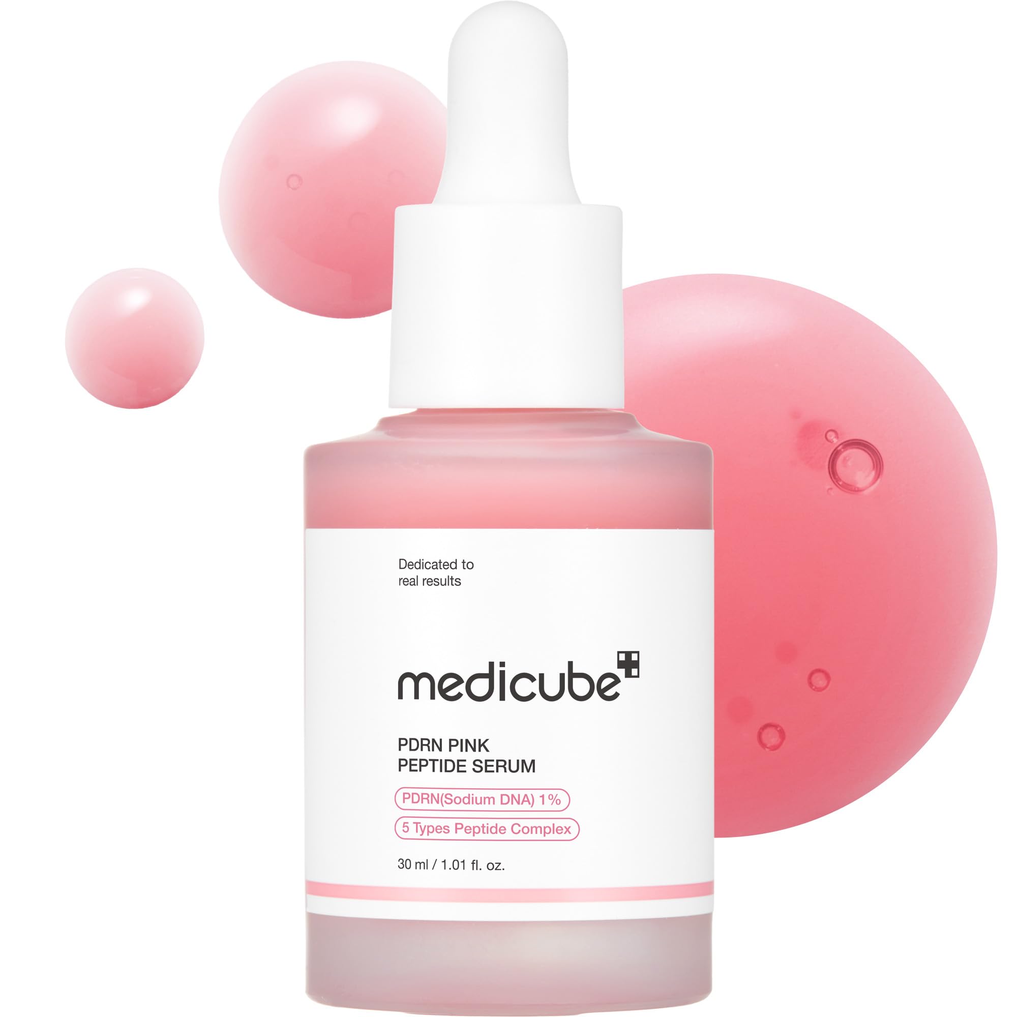 medicube PDRN Pink Peptide Serum bottle with soft pink serum spheres on a clean white background